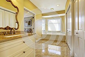 Bathroom with shiny tile floor in master bedroom