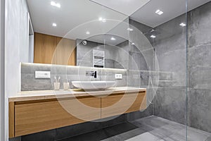 Bathroom with shower and mirror