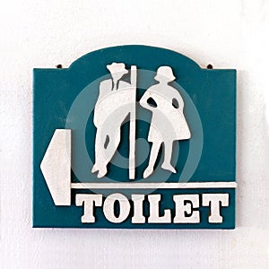 Bathroom sign, Public sign toilet male-female old vintage style on the wall of white cement, Toilet sign