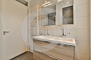 a bathroom with a sink and mirror and a shower
