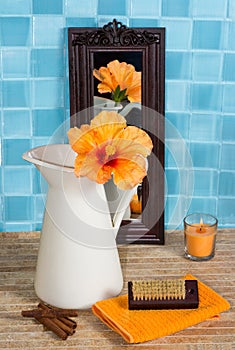 Bathroom still life with hibiscus flower in a jug