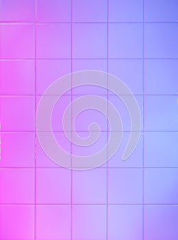 Bathroom tiles wall painted with blue and pink led light