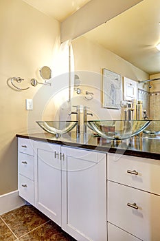 Bathroom vanity cabinet with glass vessel sinks