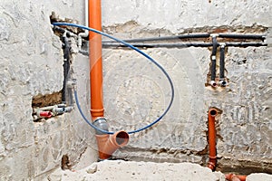 Bathroom water and drain pipe installation structure in the wall. Home repair and renovation