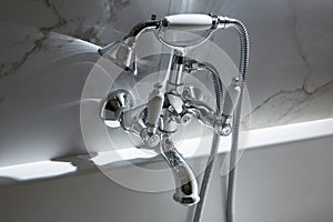 Bathroom water mixer. Water tap made of chrome material