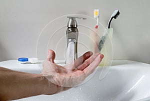 Bathroom white sink, faucet and hygienic set