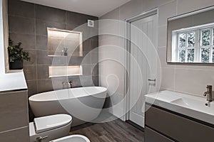 a bathroom with white toilet and bathtub next to a sink