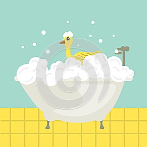 Bathtime with soap foam and yellow rubber duck. Bath with foam and toy duck.