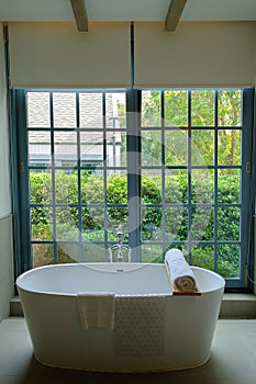 bathtub in the bathroom and light from window