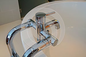 Bathtub faucet for cold and hot water in the bathroom