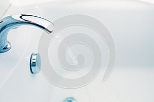 Bathtub faucet with flowing water