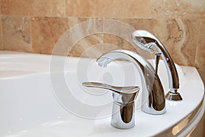 Bathtub faucet in modern bathroom.