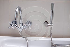 Bathtub faucet in modern bathroom