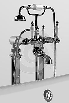 Bathtub and faucet on white background