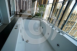 Bathtub with jacuzzi in the luxury hotel bathroom