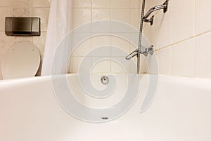 Bathtub in a tiled bathroom