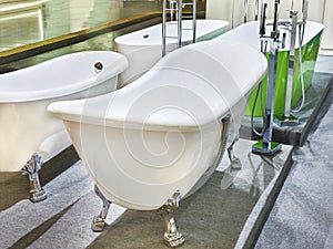 Bathtubs and tap water with shower in store
