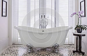 a bathtubs in white bath room photo