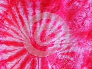 Batic or batik technique dyed silky cloths in bright magenta color and abstract pattern