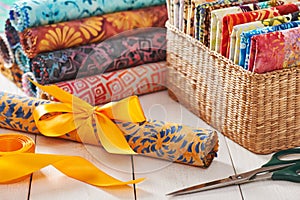 Batik kits turned into rolls tied with a decorative bow