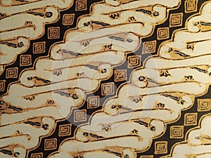 Batik pattern background.
A close up of Javanese batik with a Parang Kembang pattern. Indonesian batik. photo