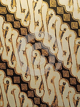 Batik pattern background.
A close up of Javanese batik with a Parang Kembang pattern. Indonesian batik. photo