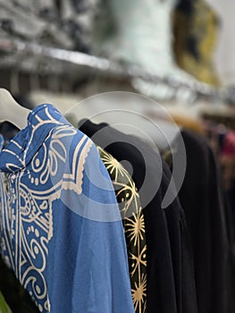 Batik shirts hanged in a cupboard