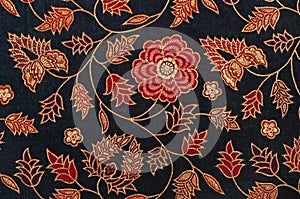 Batik textile pattern with black and red