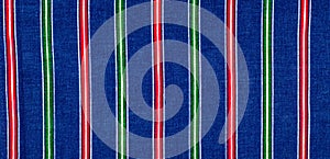Batiste fabric texture. striped coloring, red green blue white s