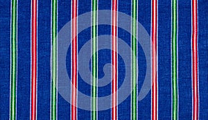 Batiste fabric texture. striped coloring, red green blue white s