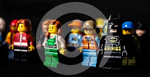 Batman and other Lego minifigures on black background