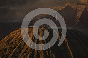 Batok mountain summit in foreground, behind, Bromo volcano, Indonesia