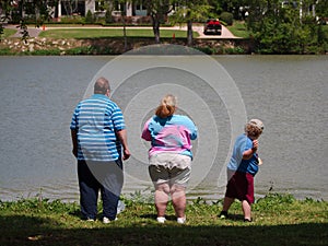 Obese family stand by Lake