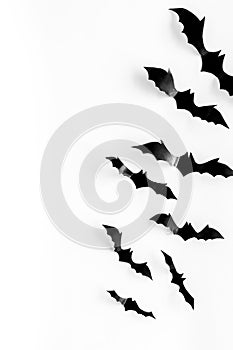 Bats cutout on Halloween frame on white table top view copy space