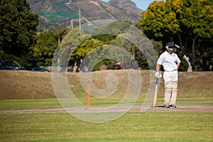Batsman standing on field during match