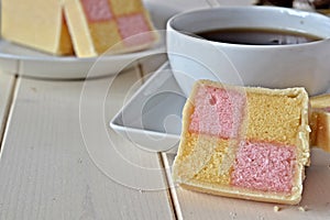 Battenberg cake with a cup of tea