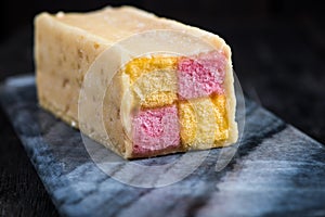 Battenberg cake on serving board