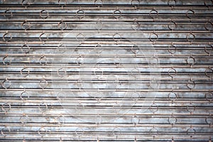 Battered Security Bars and Rusted Metal Shutters