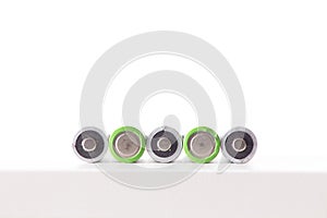 5 Batteries AA or LR6 are lying on the white table