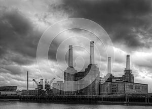 Battersea power station against dark stormy sky before local develoments changing the iconic skyline black and white image