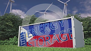 Battery container with flag of the Philippines and ENERGY STORAGE text at wind turbines. Ecological electric power