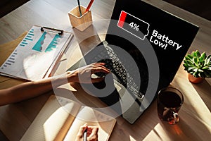 Battery low message on mobile device screen. Internet and technology concept.