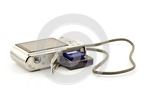 Battery and memory card in a compact camera