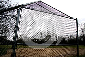 This batting cage and field are waiting for warm weather and springtime.
