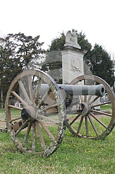 Civil War cannon in front of monument on battleground in Mississippi, United States photo