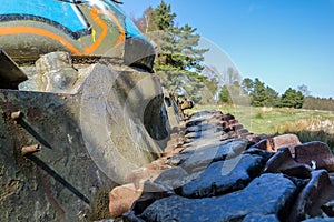 Battle tank in a moor between two forests