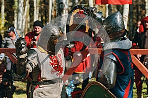 Battle of two knights in the arena. Epic sword fight.