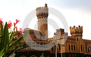 A battlement tower of bangalore palace view with beautiful garden. photo