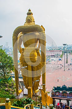 Batu Caves, gold statue Lord Murugan. Panorama view of the city. Kuala Lumpur, Malaysia.