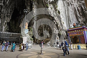 Tourists seen exploring and praying in the Hindu Temple, Batu Caves, Malaysia.